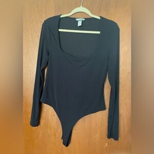 black, long sleeved body suit